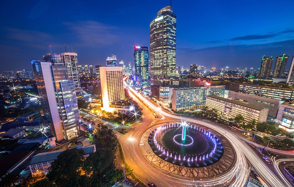 skyline of jakarta and selamat datang monument