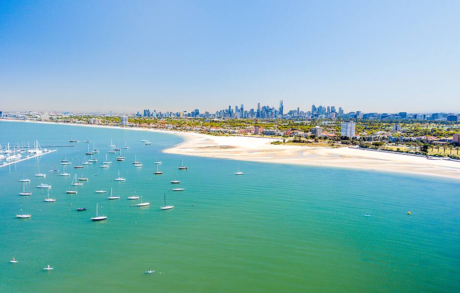 aerial view of the st kilda pier and beach in the background