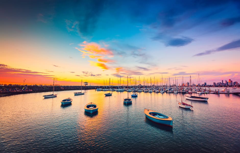 yachts in melbourne anchored in a row at sunset