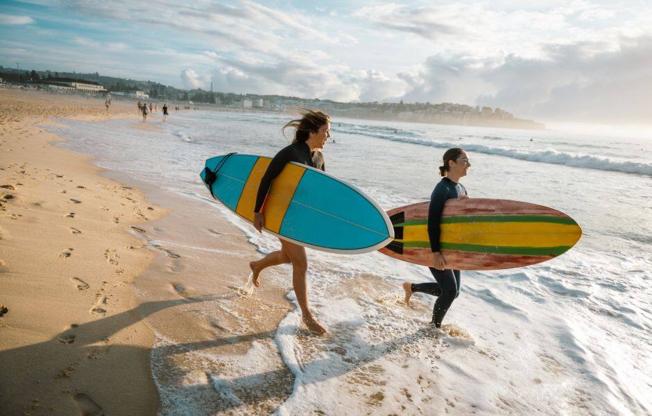 two surfers on bondi beach sydney