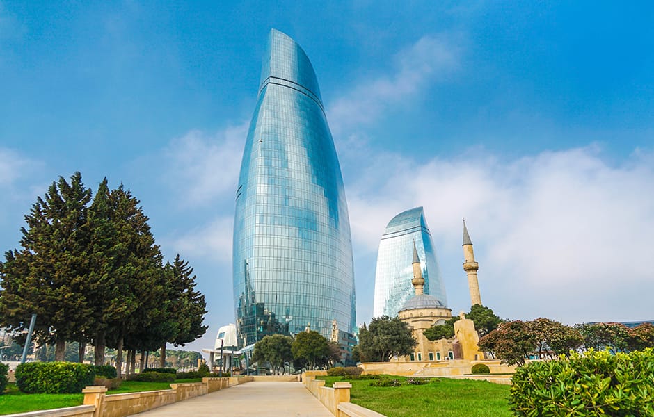 a view at night with illuminated buildings and the flame towers in baku azerbaijan