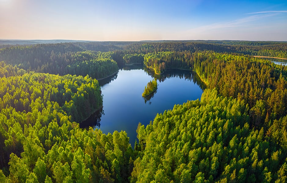 aerial photo of heart shaped lake in national park narachanski belarus