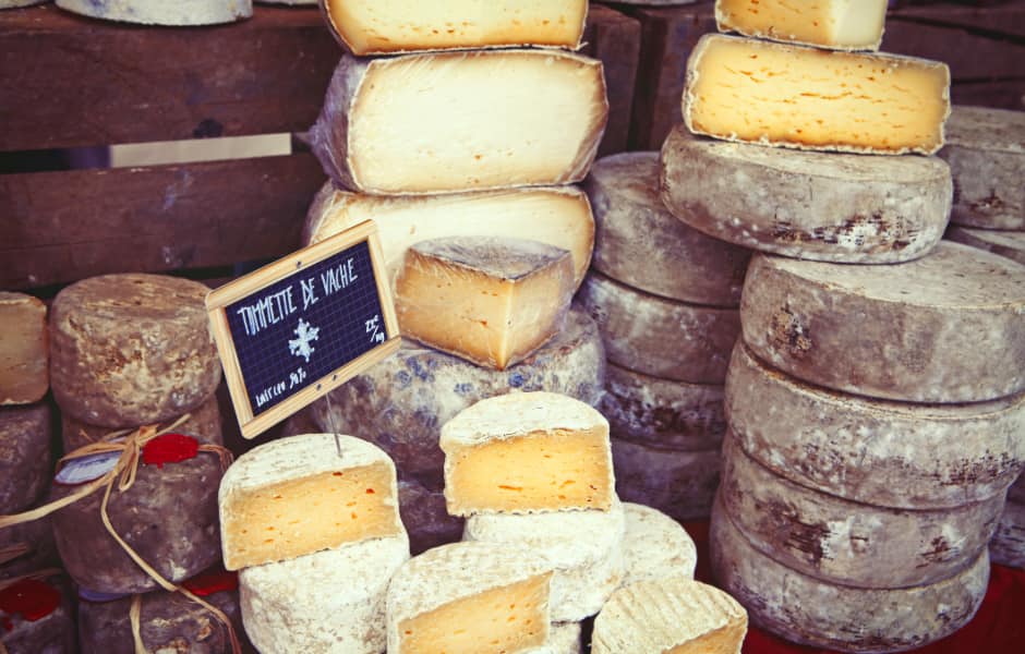 wheels of cheese in french market in paris