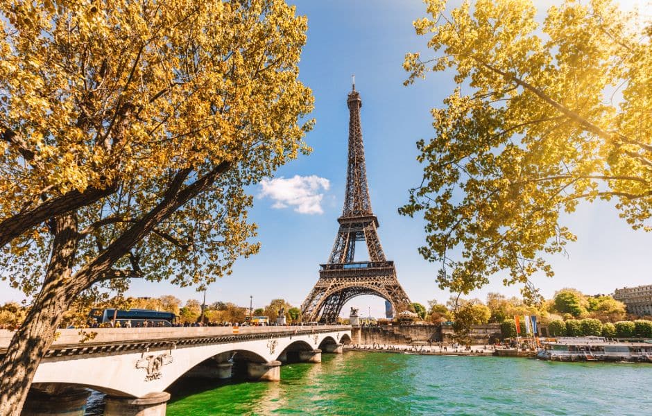 view of eiffel tower in paris from river during spring