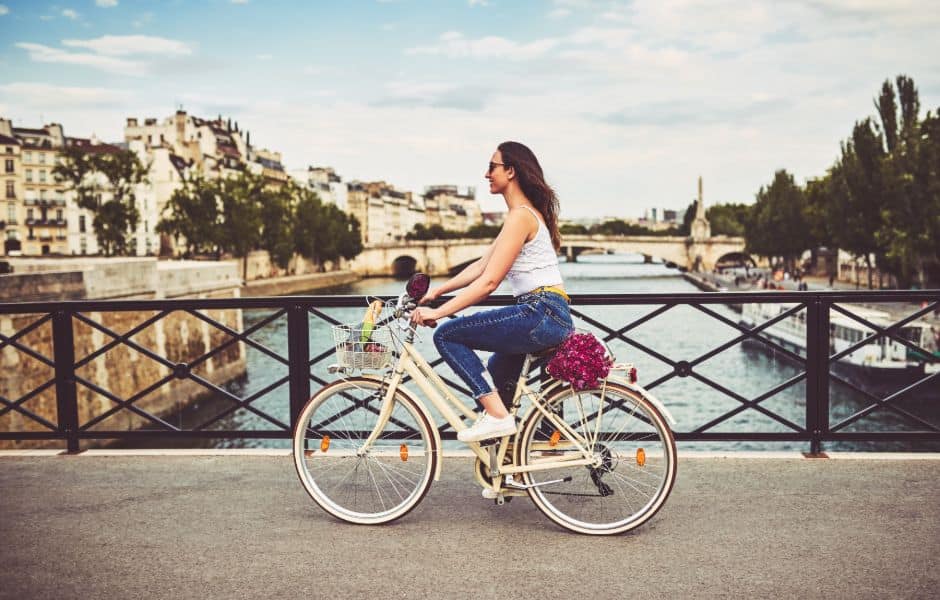 women cycling through paris in france