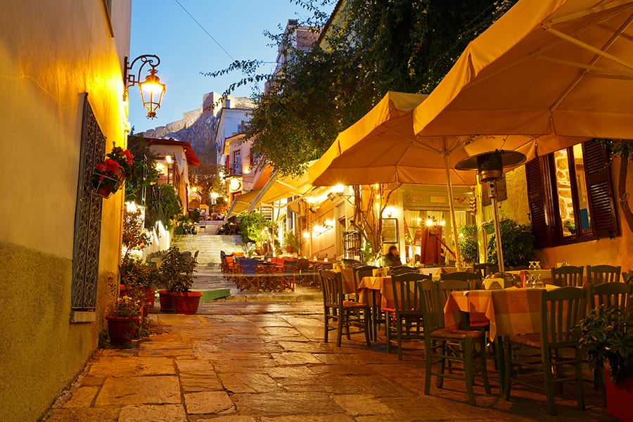 people enjoying dinner in an alley in psirri athens greece 