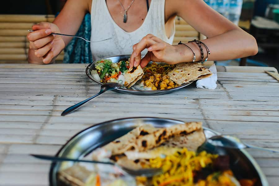 people eating vegetarian indian food