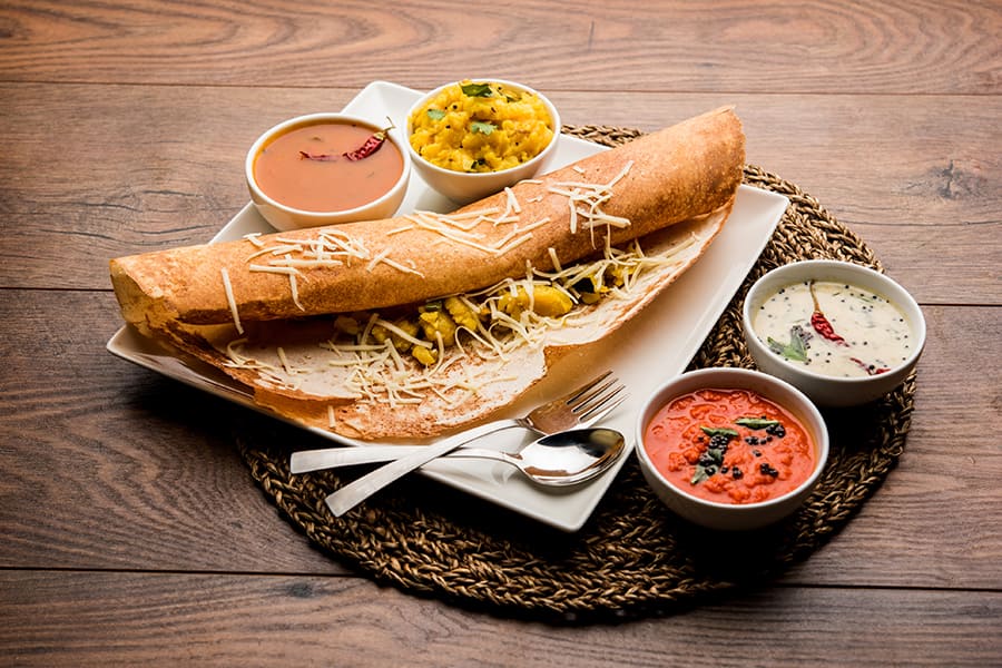 a masala dosa with sambar and chutney