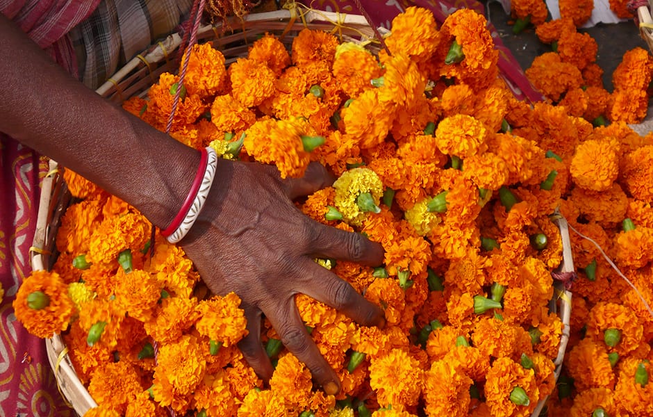 bowl of flowers at the flower market in kolkata india