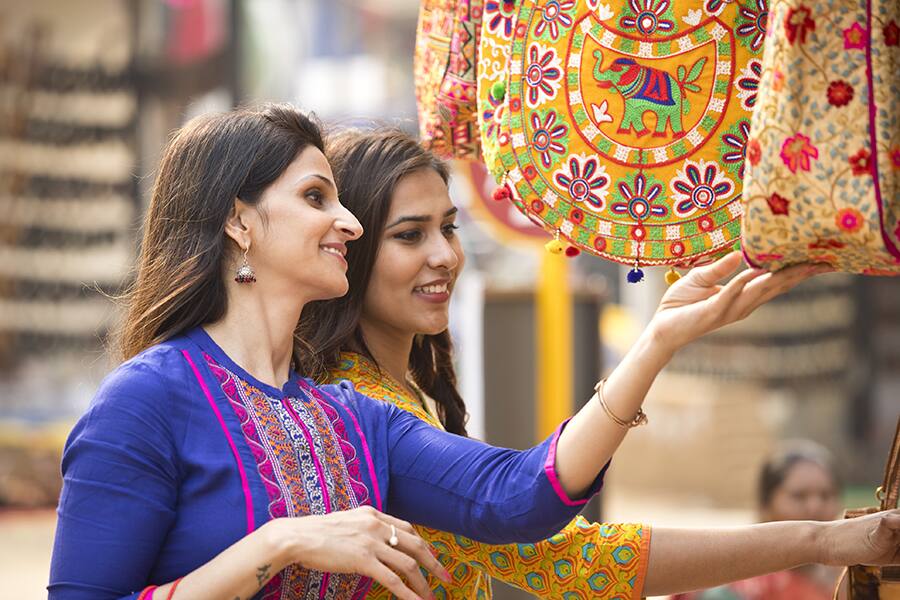 two ladies shopping souqs in kozhikode india