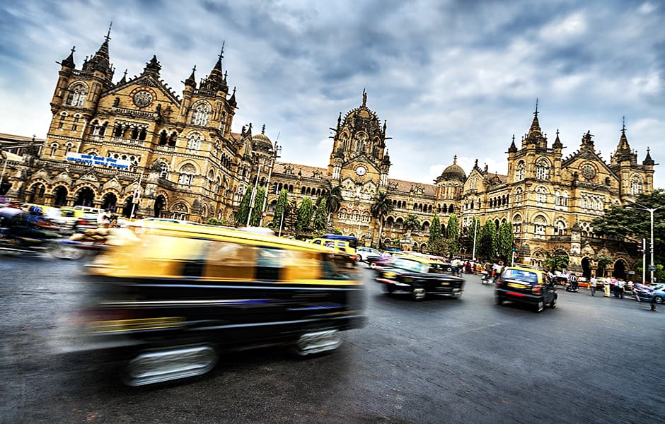 busy traffic infront of the chhatrapati shivaji terminus in mumbai india