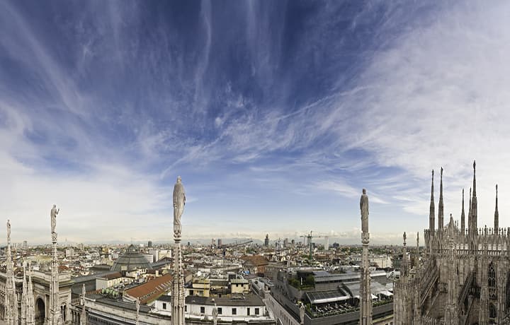 skies over landmarks milan italy 