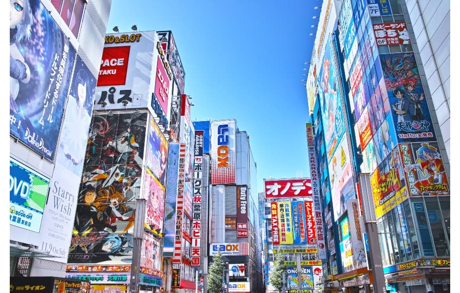 bright signs outside akihabara station tokyo