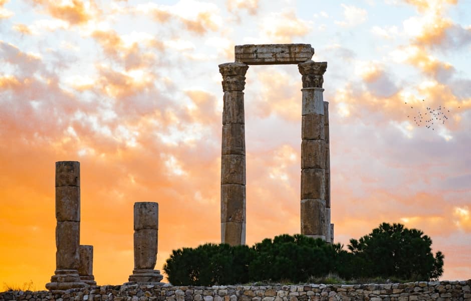 ancient columns at sunset in amman citadel jordan