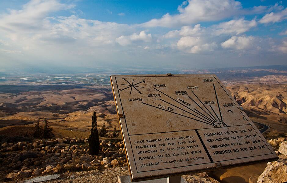 view from the top of mount nebo of jordan with plaque