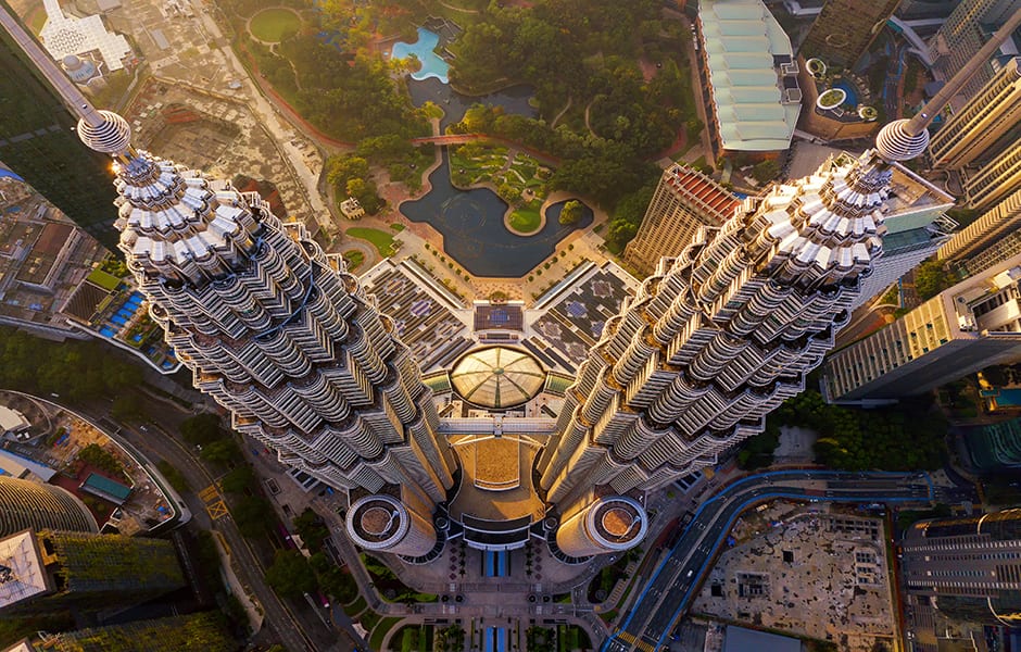 top down view of petronas twin towers and financial district