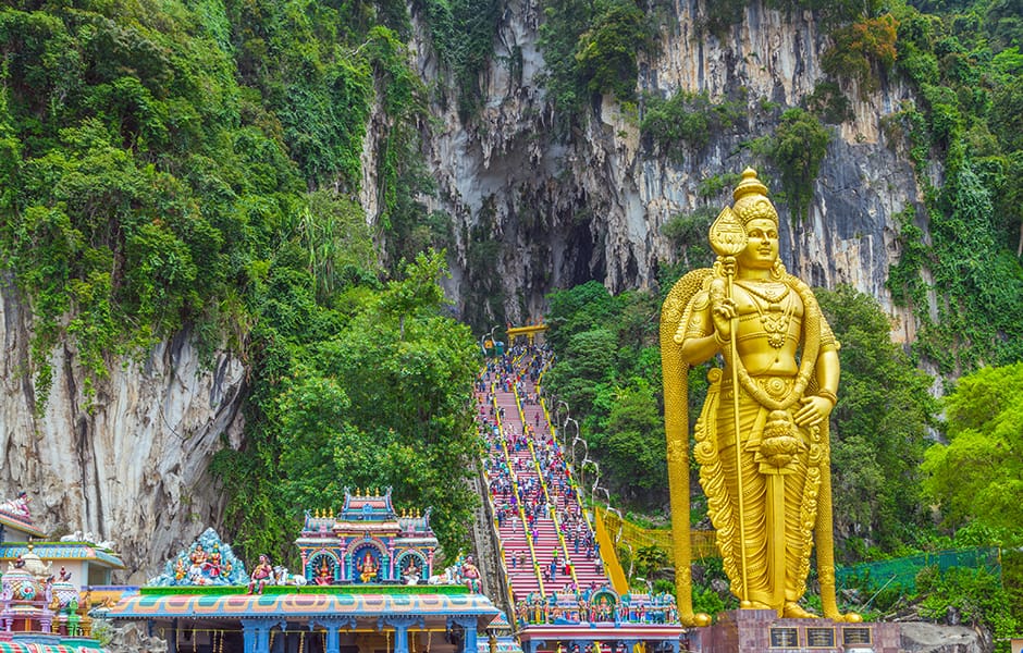 batu caves with golden statue 