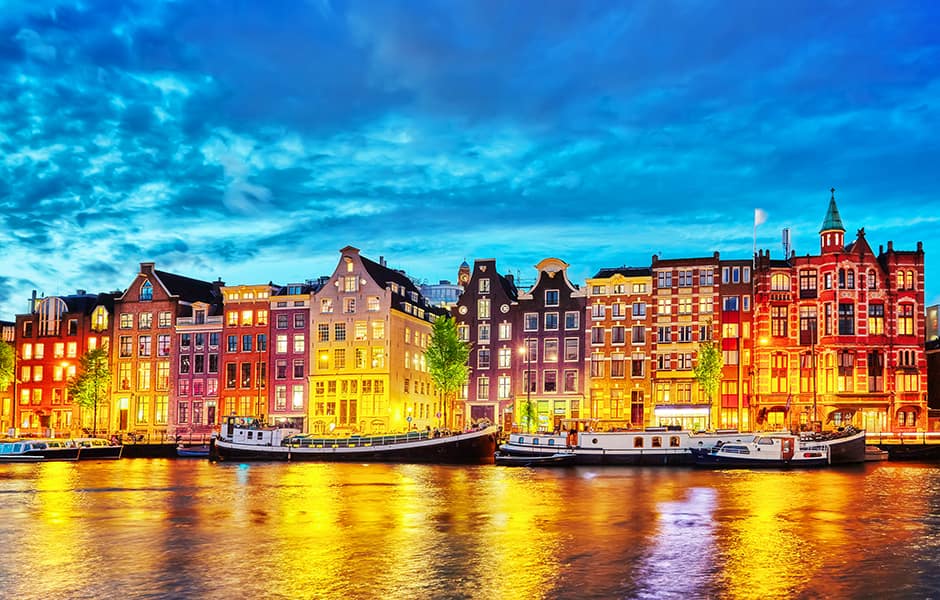 amstel river at night with lights reflecting in water