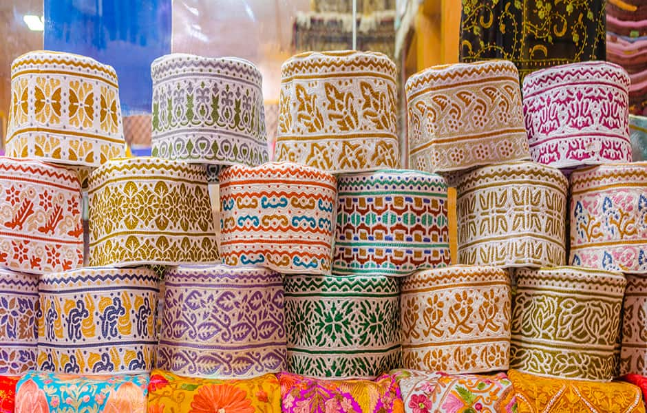 hats on display at the mutrah souq in muscat oman