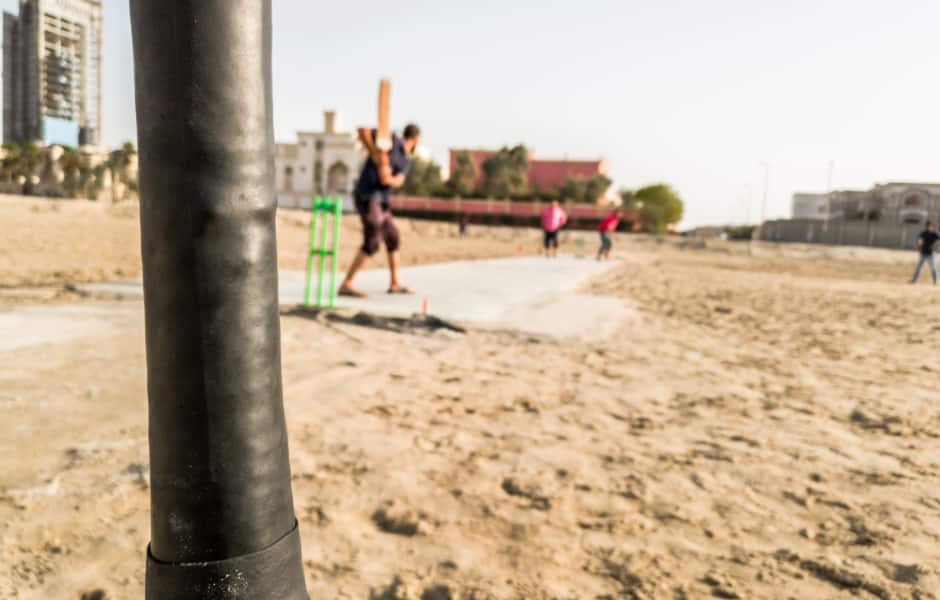 close-up of cricket game on sand in pakistan