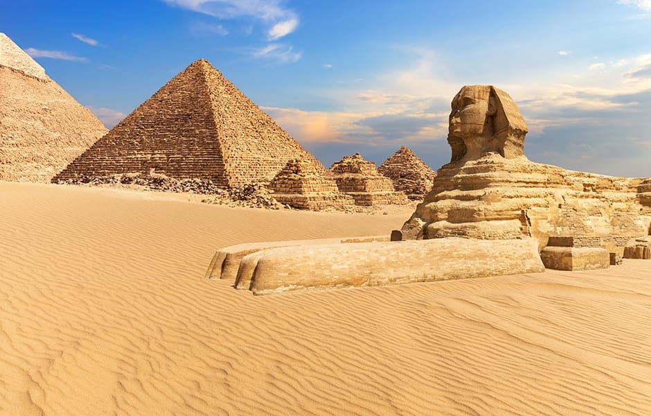 pyramids of giza guarded by the sphinx