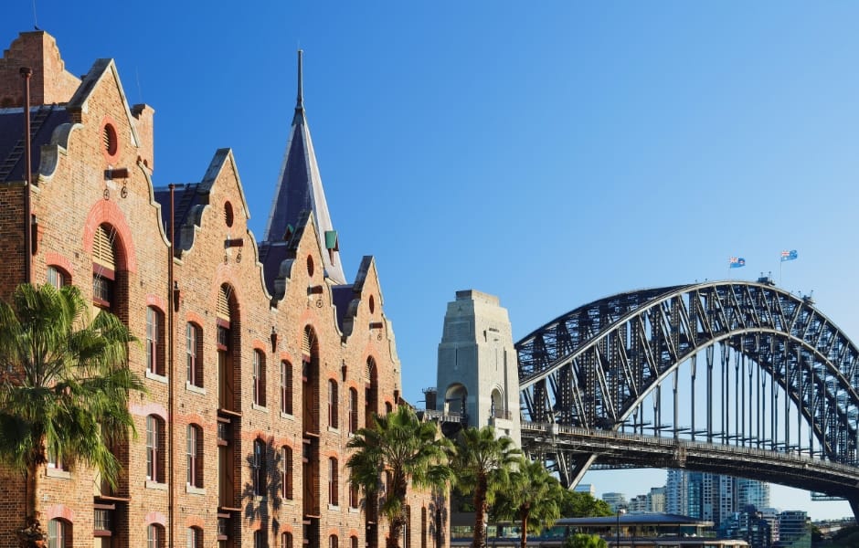 view of george street in the rocks and the harbour bridge in the historic district of sydney