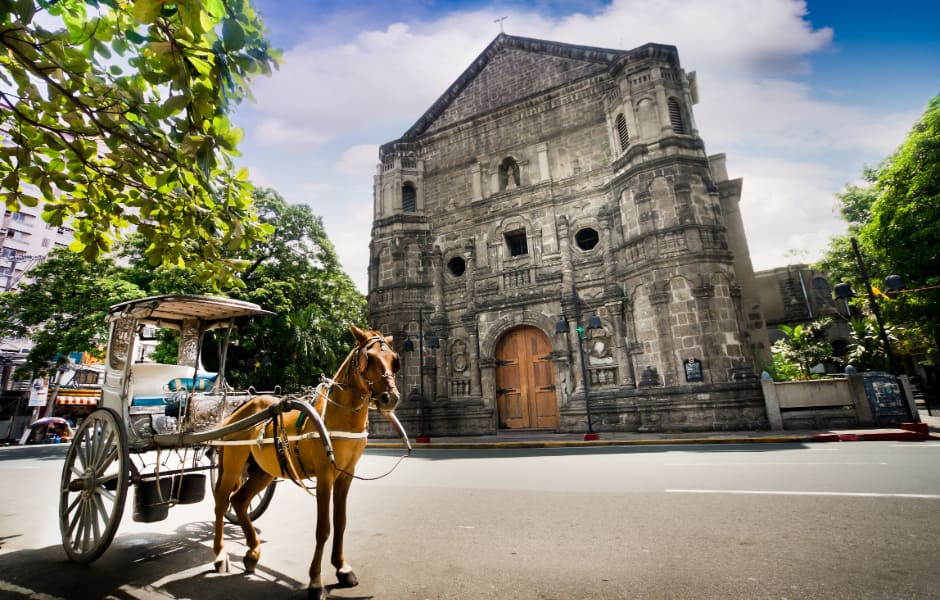 horse drawn carriage outside malate church manila philippines