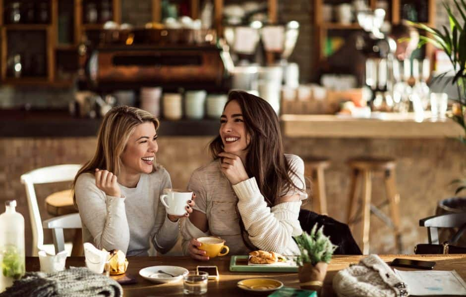 two women drinking coffee in a cafe in belgrade serbia