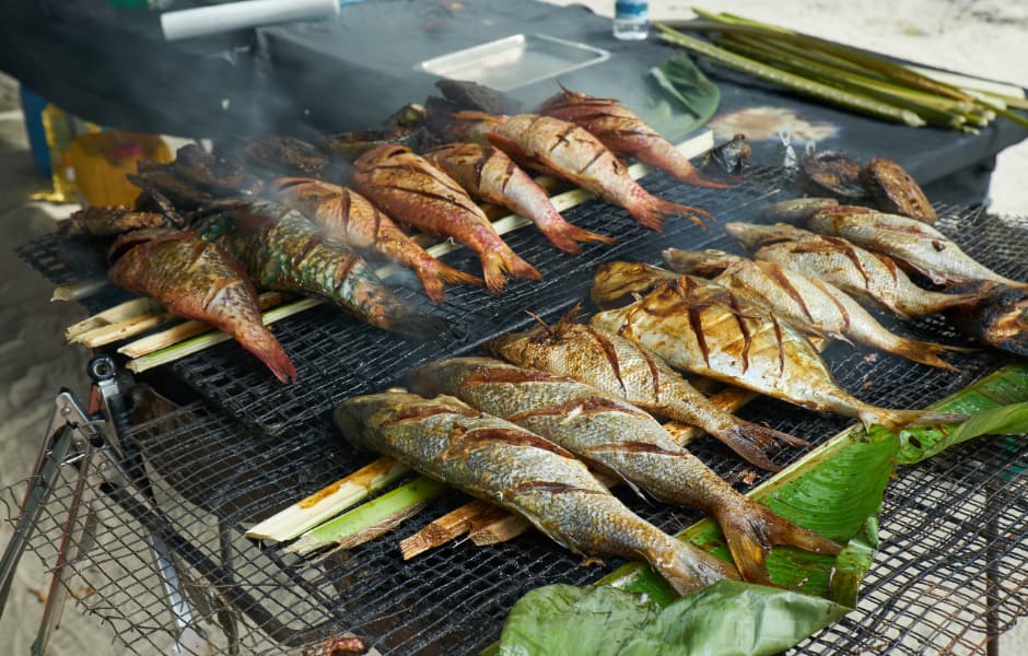 close up of fish grilling on a bbq in the seychelles