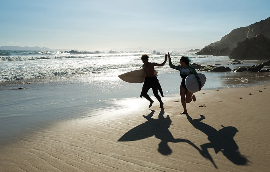 children running along beach