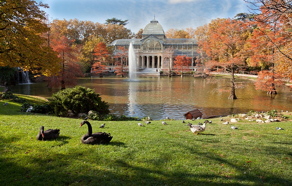 view of crystal palace in retiro park madrid spain