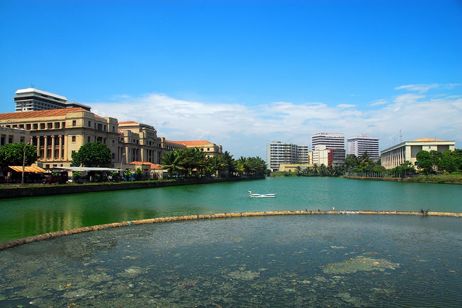 beira lake in colombo with skyscrapers in the background