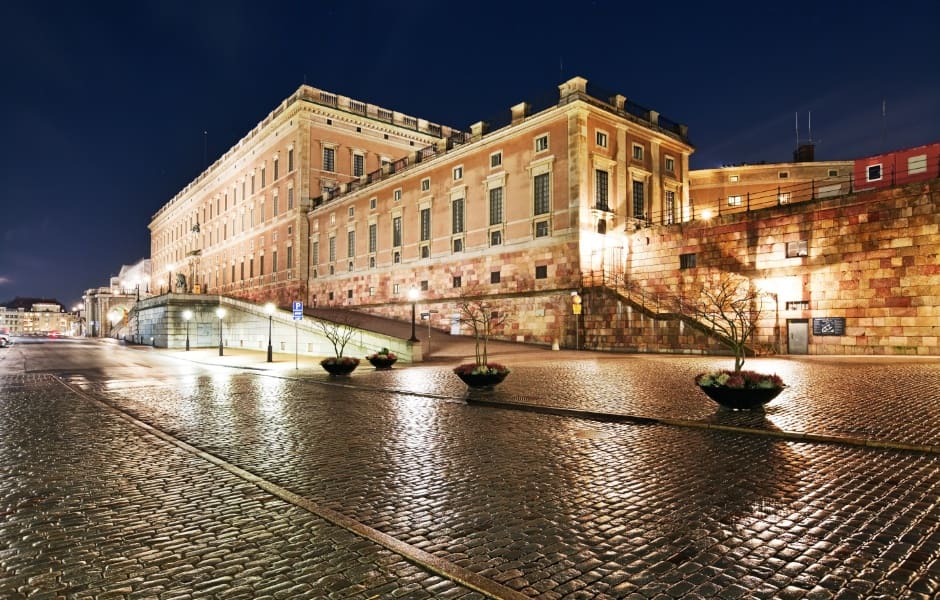 stockholm palace lit up during evening