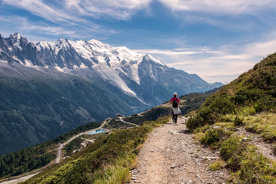 woman walking on a foot path by mont blanc geneva switzerland