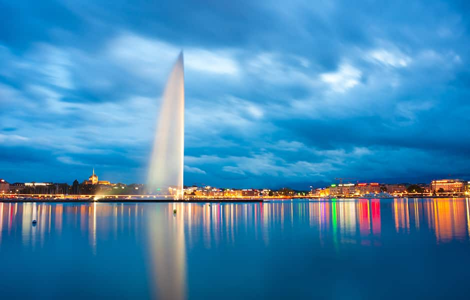 view of jet d'eau at night in geneva