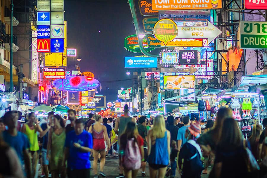 people walking along khao san road market in bangkok thailand at night