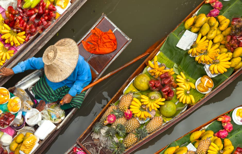 several small boats part of floating market in bangkok thailand