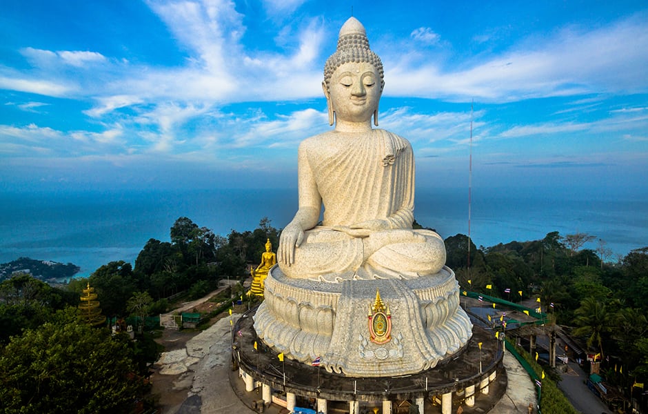 blue skies and big buddha statue on nakkerd hills in phuket thailand