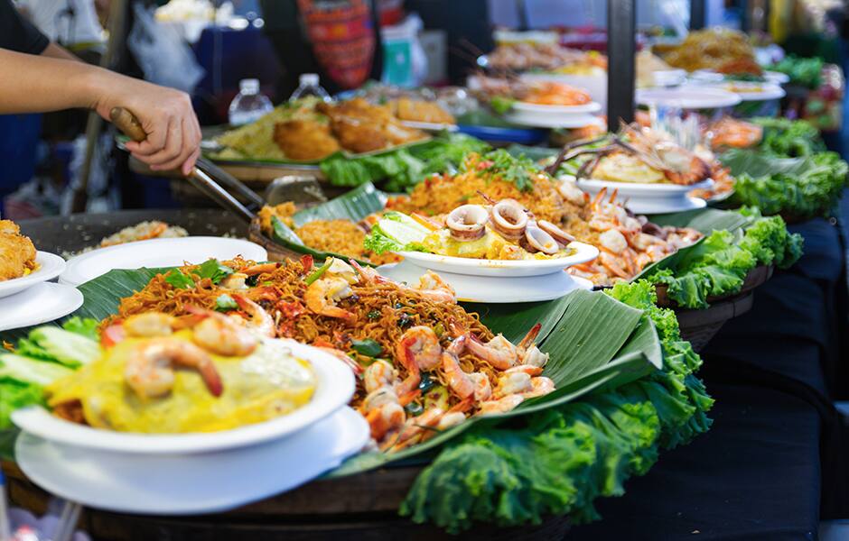 plates of local food street market phuket