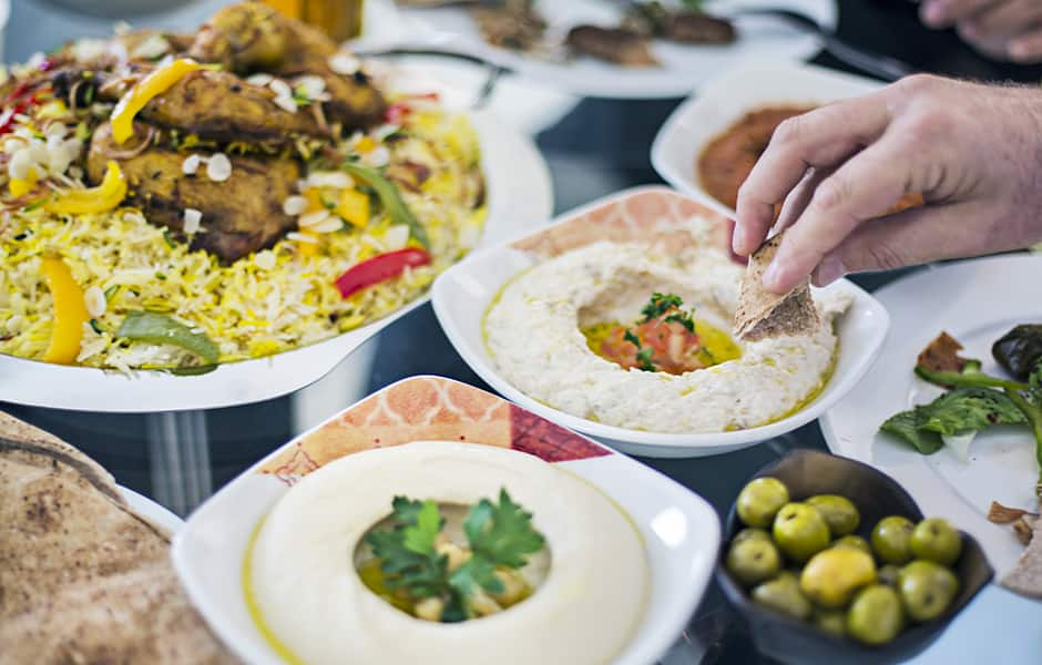 dining table filled with different mezze in dubai united arab emirates