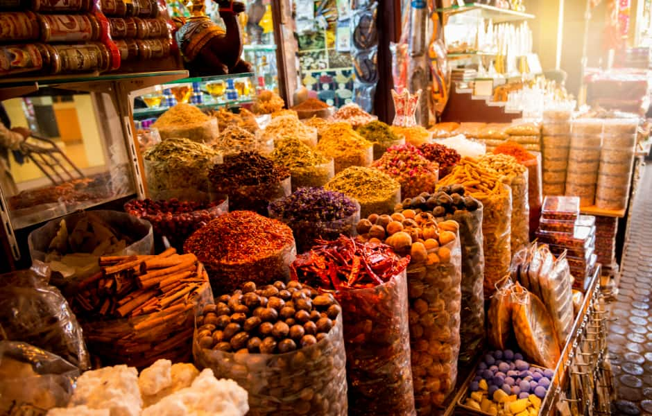 a range of spices and fresh produce at a souk in dubai