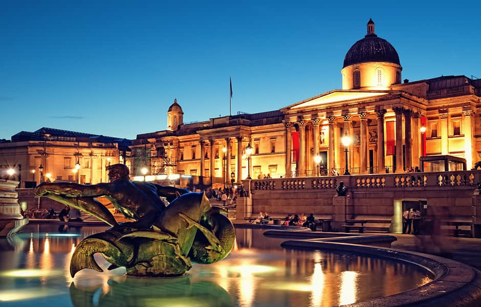 view of the national gallery and trafalgar square at night london uk