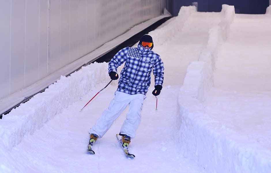 skier on an indoor ski slope manchester