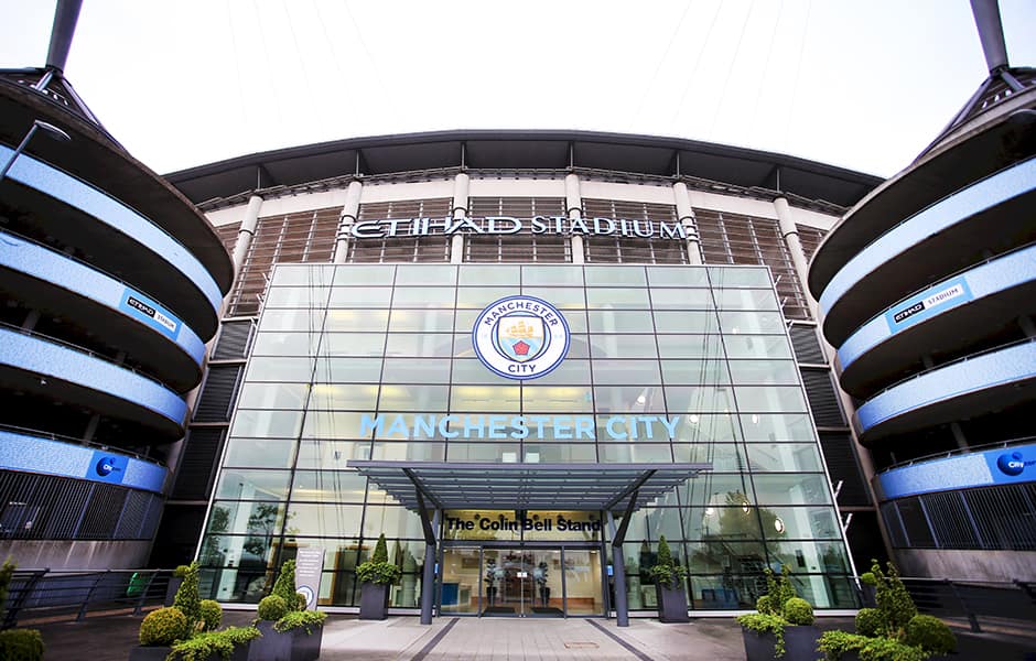 the outside of etihad stadium the home of manchester city football club