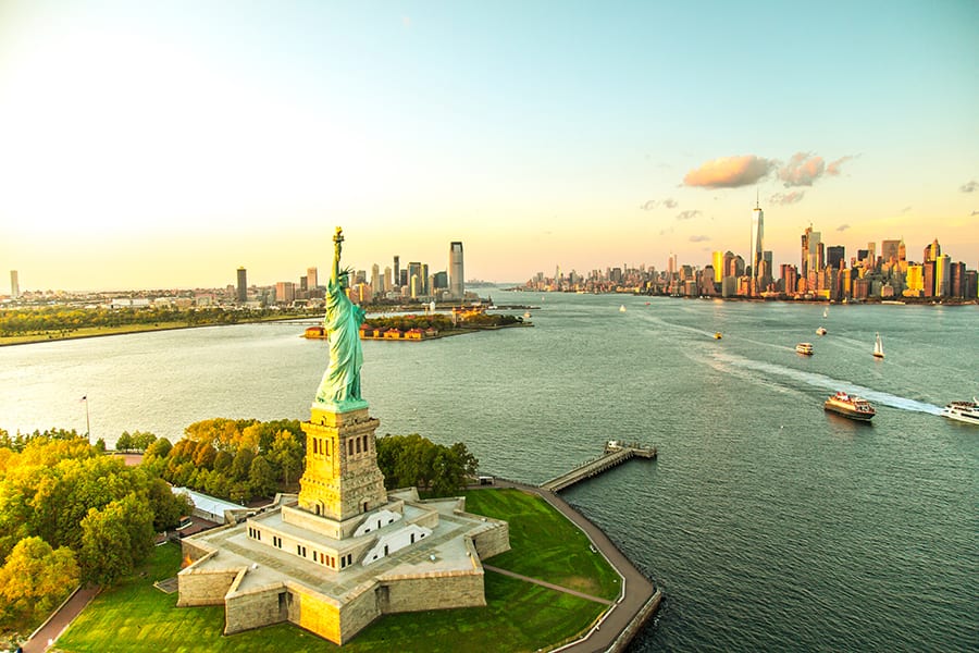 statue of liberty overlooking manhattan in new york city usa